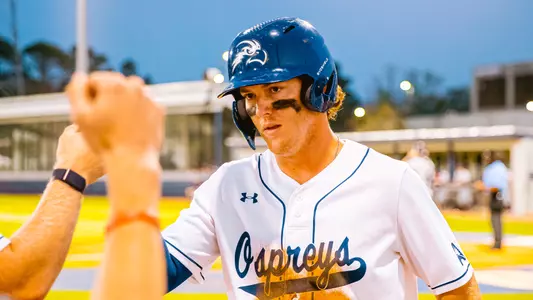 Cade Westbrook high fives going back into the dugout.