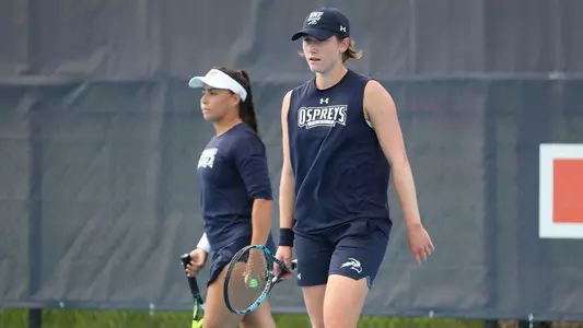 Kit and Ana walking on the court at NCAA Nationals