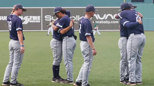 unf team hugs postgame against Jacksonville