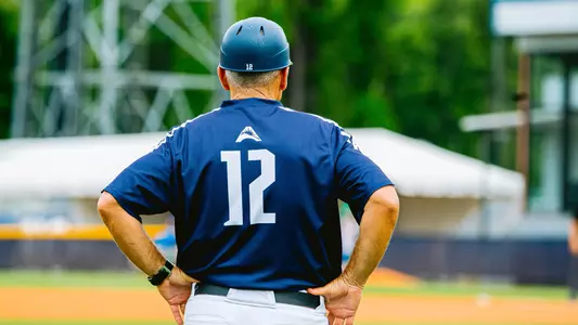 Head coach Tim Parenton looking on from third base