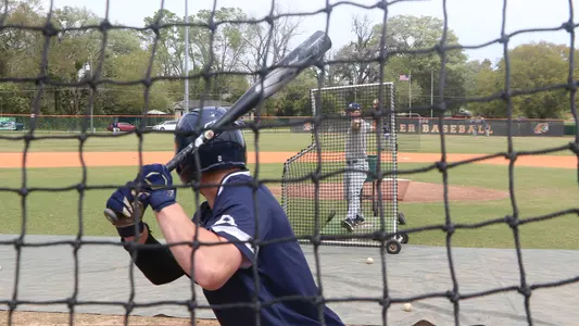 Ian Brown swinging at batting practice pitches