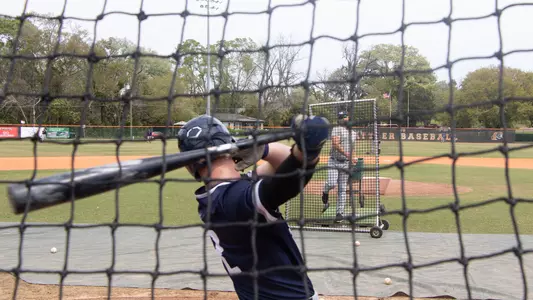 Ian Brown swinging at a pitch