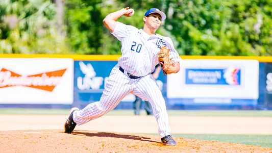 Jason Gonzalez throwing a pitch at home