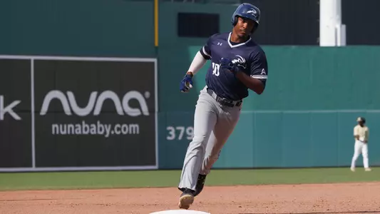 Justin Holmes rounding third base
