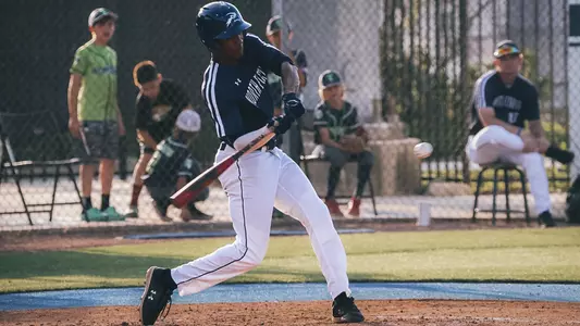 Justin Holmes swinging at a pitch