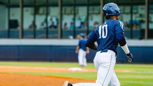 Justin Holmes rounding third base