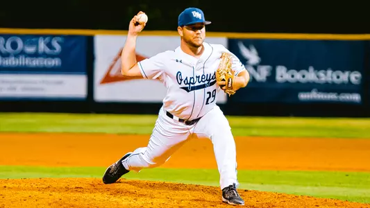 Justin Parrish throwing a pitch at a game
