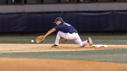 Caleb Stafford catching the ball at first base.