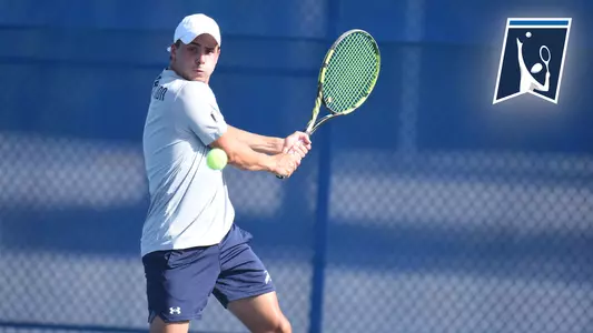 Dominik Barton hitting a backhand with a logo