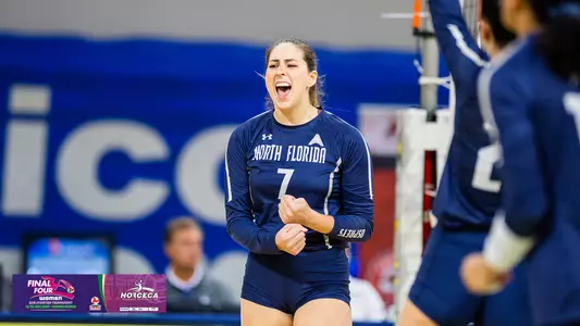 Solimar Cestero celebrates a point with a norceca logo in the lower left cornerSolimar Cestero celebrates a point with a norceca logo in the lower left corner