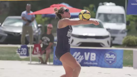 Madeline camp setting the ball