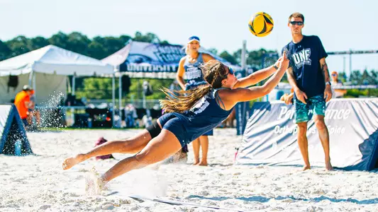 Madeline Camp diving after the ball