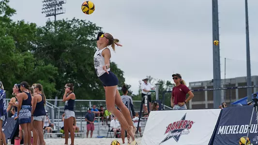 Anna Mallory serving the ball