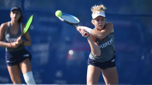 Anslee Long hitting a backhand