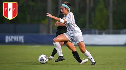 Ariana Munoz kicking the ball forward with a FPF logo