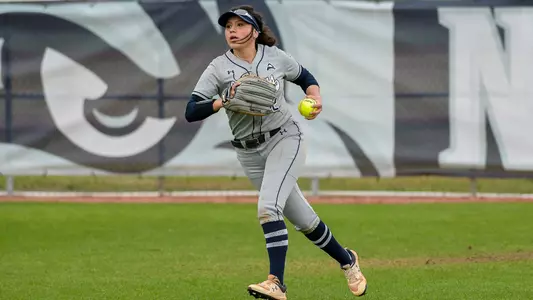 Bailee Aguigui running with ball in the outfield