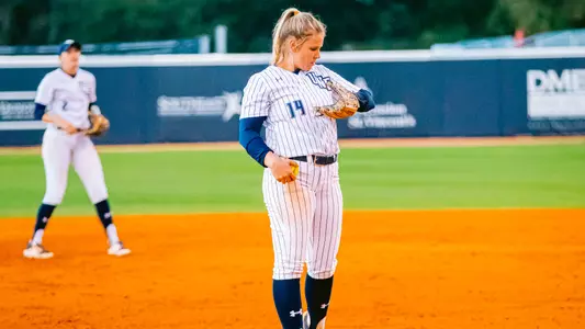 Erin Kyle looking into pitch sleeve on wrist