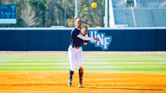 Takiya London throws one from shortstop to first
