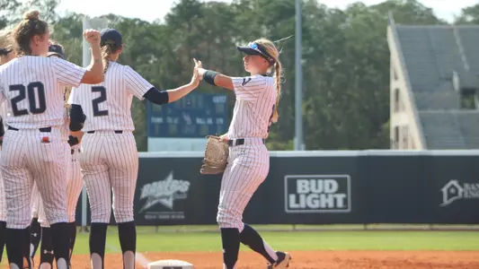 Regan Hermeling high fives teammates