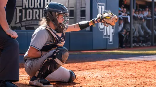 Mackenzie Woods catching behind the plate