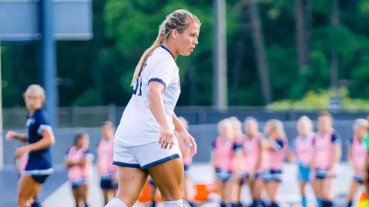 Allie Fekany walking on the field