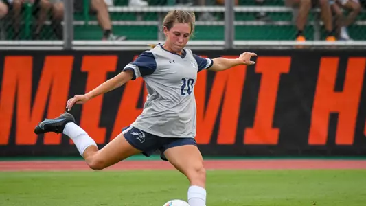 Amanda Hartmann kicking the ball