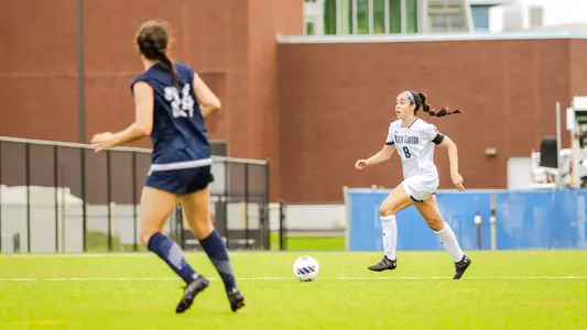 Ariana munoz bringing the ball up the field