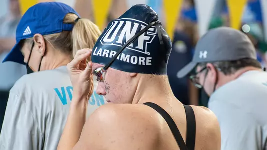 Allie Larrimore adjusting her cap