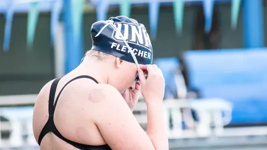 Annie Fletcher putting her goggles on