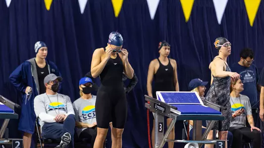Ashley Cozad putting her goggles on