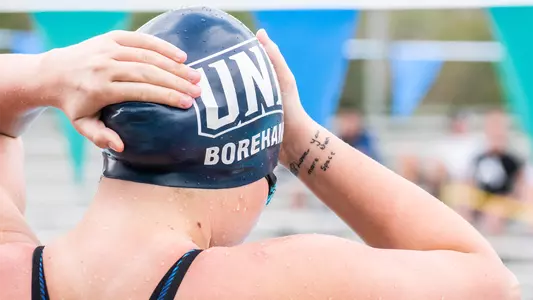 Bria Boreham adjusting her cap