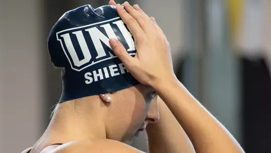 Sarah Shiers adjusting her cap