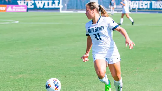 Allie Fekany dribbling the ball up the field against MTSU