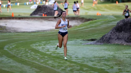 Mia McLain running on the road