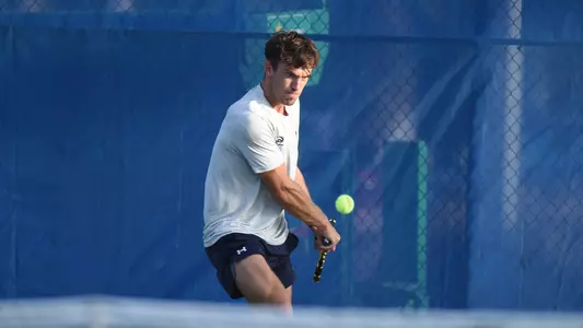 Matt Carroll swinging with a two-hand backhand