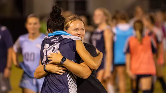 hugging post match photo at Stetson