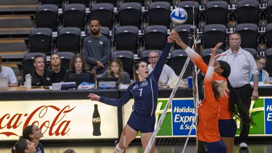 Solimar Cestero going up for a block at the net