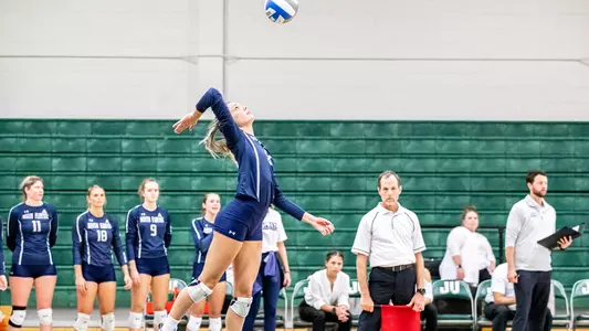 Amy Burkhardt serving the ball from the line