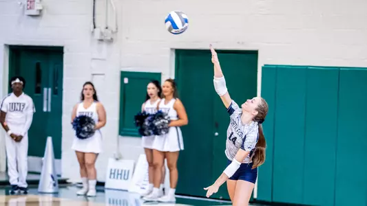 Maymie Guthrie swinging on a serve