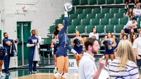 Kailey McKnight going to make a serve on a ball