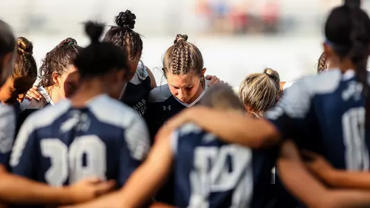 North Florida women's soccer team huddle at Georgia