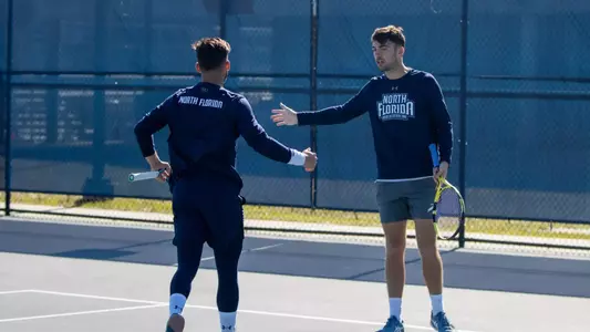 Breno Marques and Matt Carroll high fiving