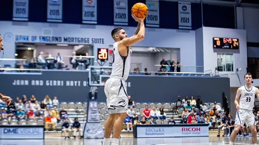Jose Placer shooting a jump shot vs. Liberty