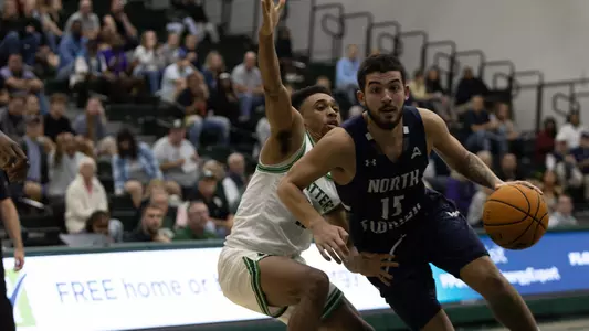Jose Placer dribbling to the hoop