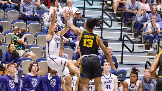 Jose Placer shooting a jump shot from the corner