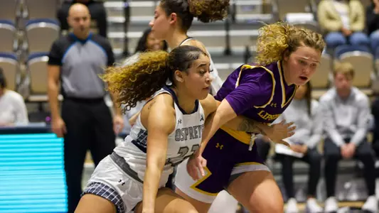Lyric Swann driving down lane against Lipscomb