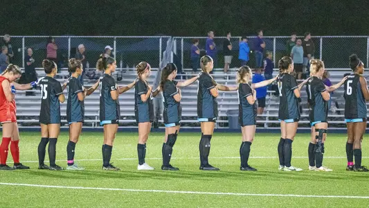 unf women's soccer lining up for national anthem