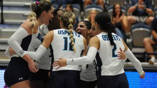 UNF volleyball team photo against EKU