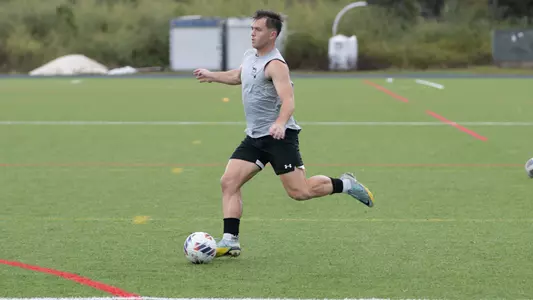 Herbie Steigelman at practice kicking ball