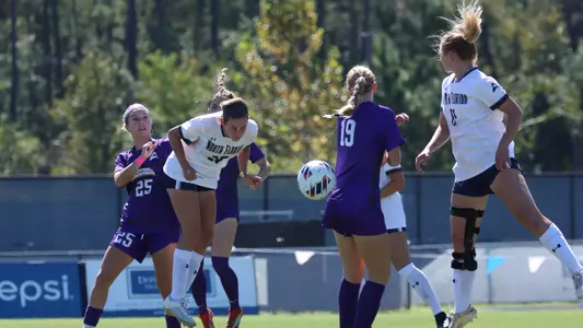 Sophia Goetz and Amanda Hartmann going up for a header